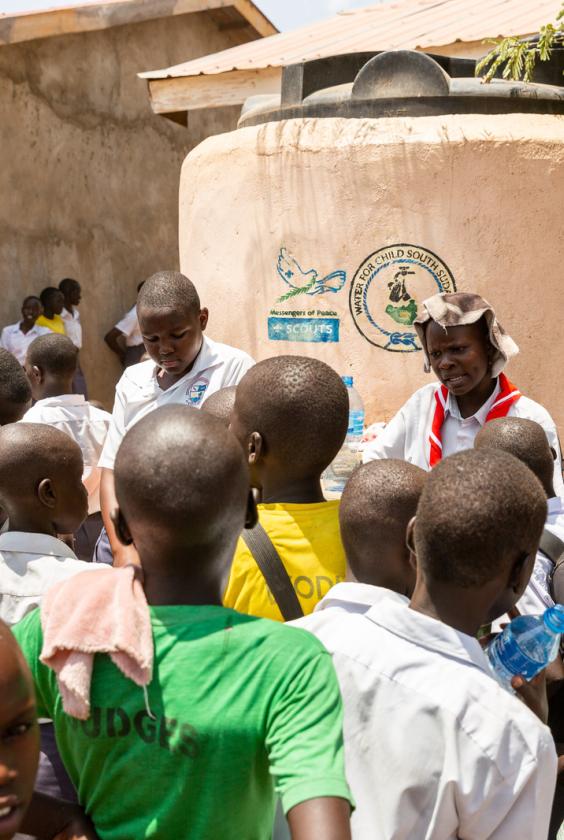 scouts from kenya gethered around to get frsh water