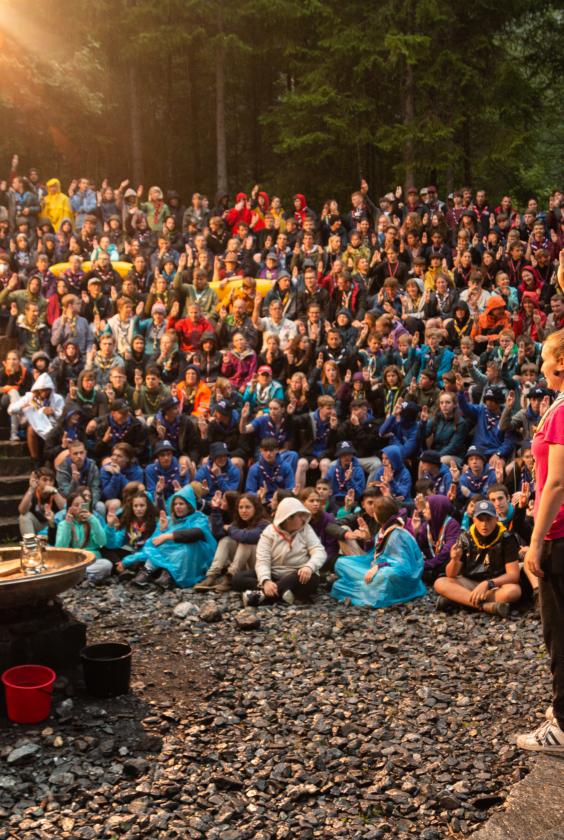 a scout leader doing the scout sign