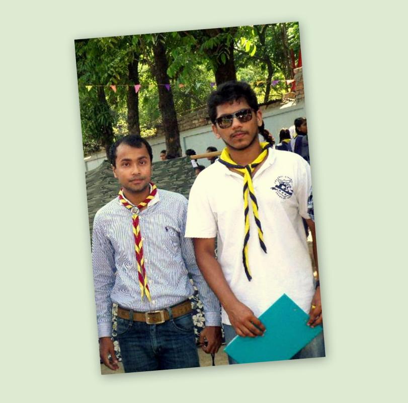 TWO BANGLADESHI SCOUTS BLOW OUT THE FIRE OF A B.R.T.C. BUS 