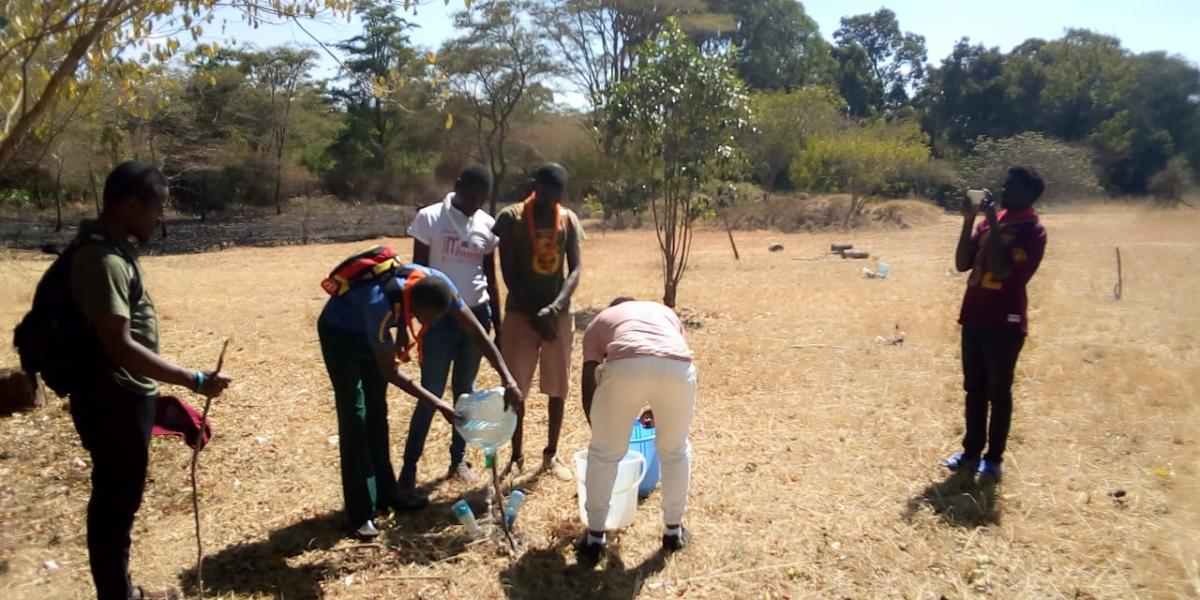 kenyatta university scouts in kenya plant trees to help the country achieve its agenda of a green country and also they had a plastic bottles challenge theough irrigation