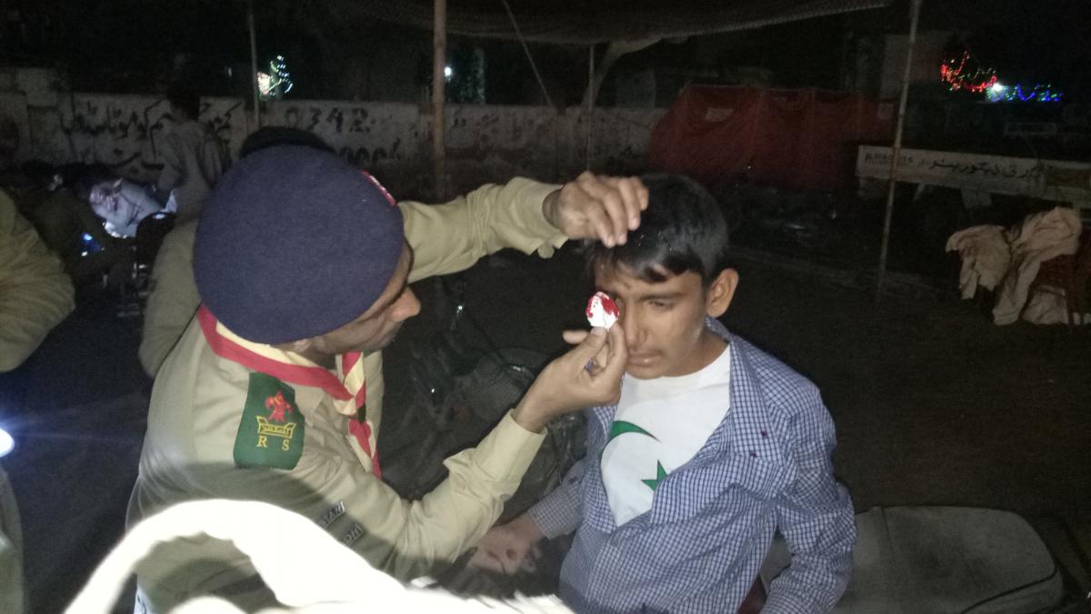 AIM SCOUTS providing first aid