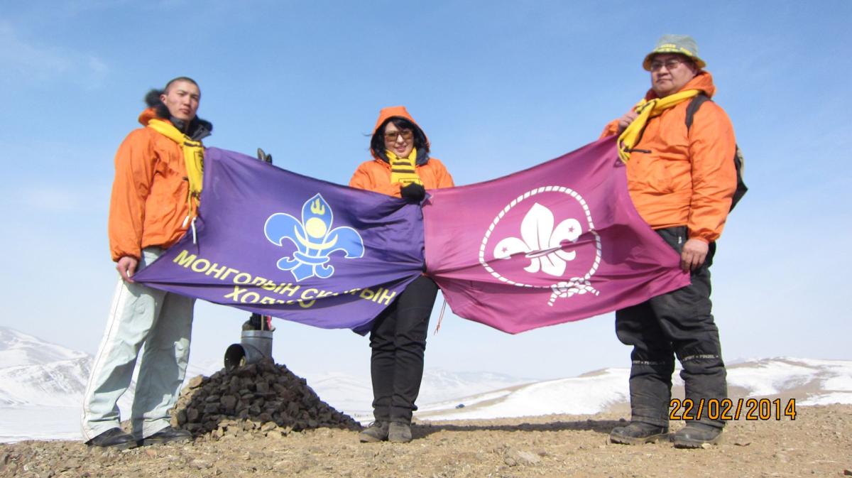 Raising flag at top of Mountain