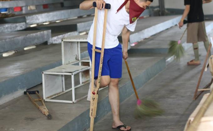 Rover scouts of Udonthani Vocational Collage Thailand   cleaning  their college   on   February    15, 2015.