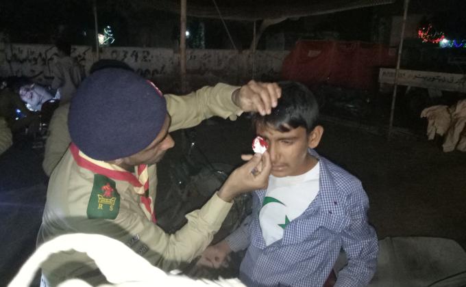 AIM SCOUTS providing first aid