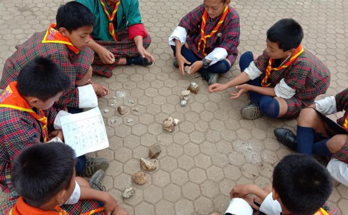 scouts hand experience on trail sign