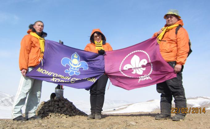 Raising flag at top of Mountain