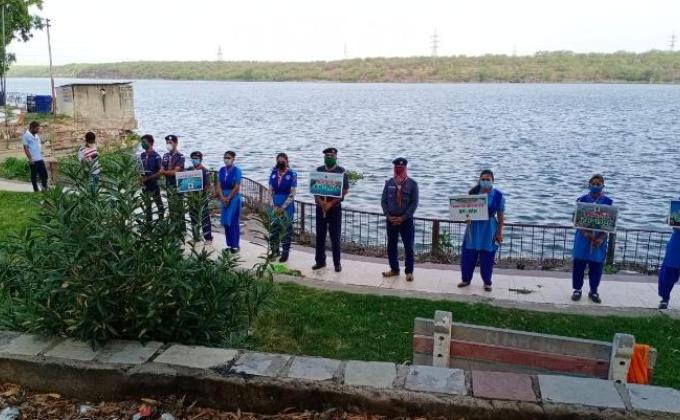 Message of environmental protection given by creating human chain. 