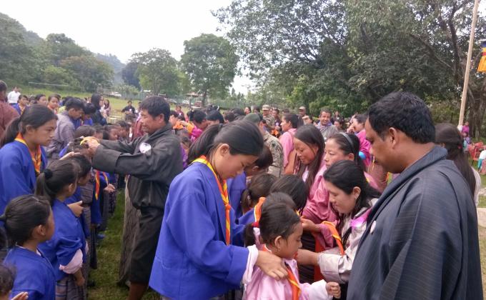 Investiture ceremony involving community