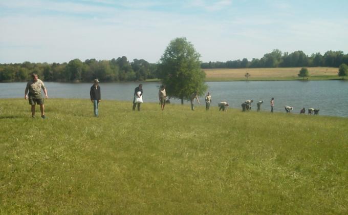 Boy Scouts clean up a park at a National Historic Site