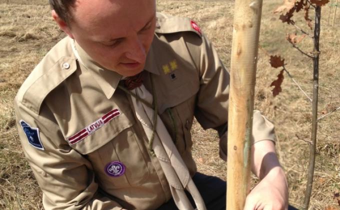 Continuing Latvian ancestor traditions, planting Poweroak Grove